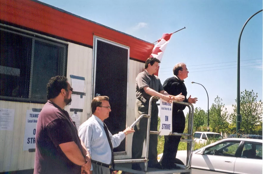 Bobby Kornhass and retired Director of Organizing Mike Crawford listen as Teamsters Canada President Robert Bouvier  and Bob Ryder address striking workers